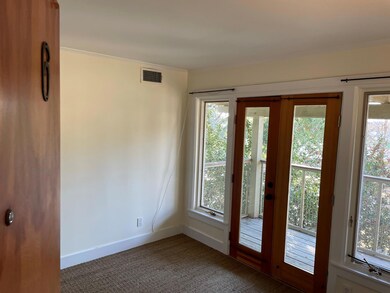Doorway with plenty of natural light, baseboards,