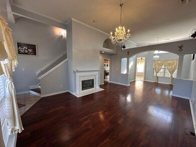 Unfurnished living room with a fireplace, a chande