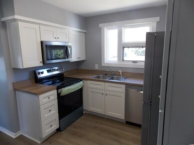 Kitchen featuring NEW stainless steel appliances, 