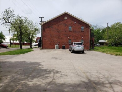 View of side of property featuring central AC unit