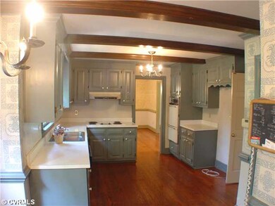 Kitchen - Hardwood flooring and plenty of cabinet 