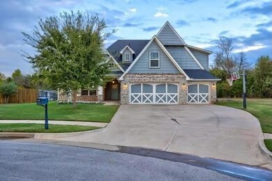 Craftsman inspired home featuring a garage and a f