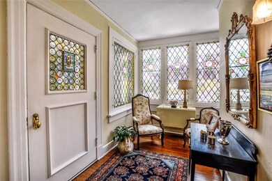 A welcoming entry with beautiful leaded and staine