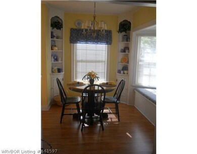 Dining Room. Custom shelving accompany the bay win