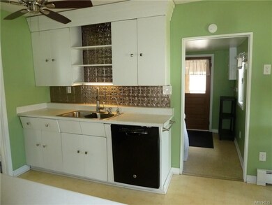 Cabinets are spacious and allow for your kitchen storage needs.  With the laundry / mechanics just off the kitchen.
