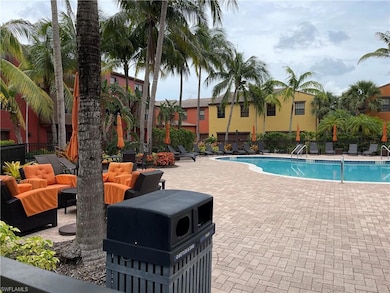 Community pool featuring a patio area and an outdoor living space