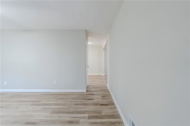 Corridor featuring light hardwood / wood-style floors