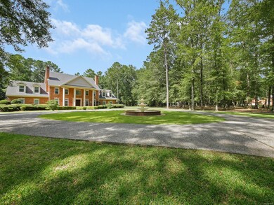A tree-lined driveway leads to this peaceful escape.