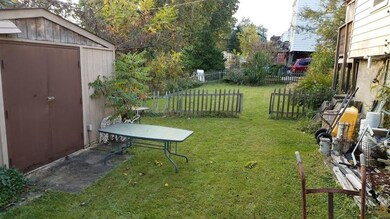 HUGE lower level yard. Shed for lots of storage.