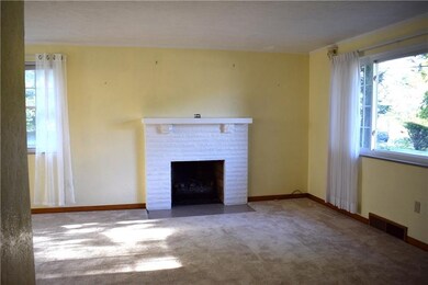 Living room with gas fireplace! Large window makes