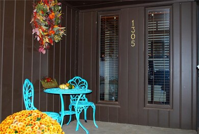Quaint front porch welcomes you into this fantasti