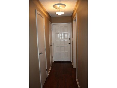 Entry hall has a half bath, a coat closet and a ut