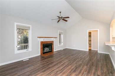 Family Room w/ vaulted ceiling, luxury vinyl plank
