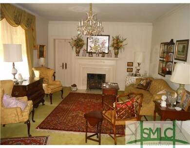 Living Room. Gas Logs Doors lead to Sun Porch