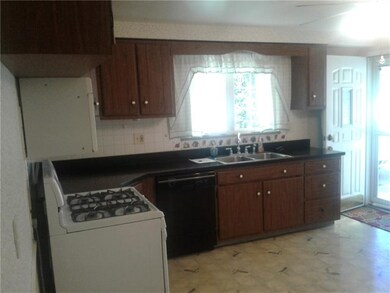 Another view of bright and inviting kitchen