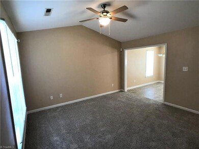 The living room opens to the kitchen area.