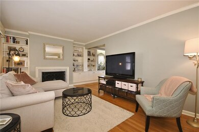 Crown molding and chic colors add sophistication.
