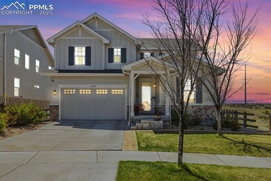 Craftsman-style home featuring concrete driveway, 
