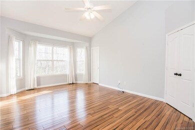 Stunning master bedroom with high ceilings and natural light!