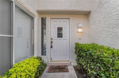 Property entrance featuring stucco siding