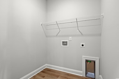 Clothes washing area with hookup for an electric d