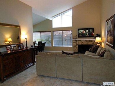 VAULTED CEILING AND OPEN FLOOR PLAN ADD VOLUME TO 