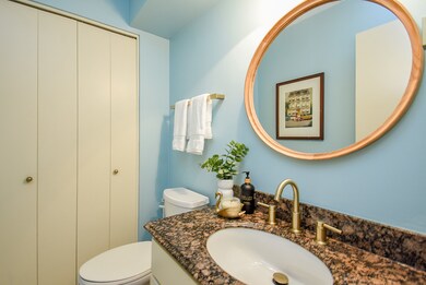 VANITY BATHROOM IS LOCATED BEHIND THE STAIR CASE A