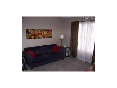 The living room has newer carpet and offers a lot 