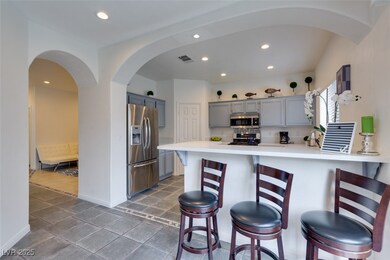 Kitchen with stainless steel appliances, gray cabi