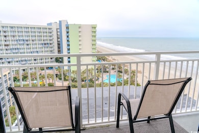 Balcony with a water view and a beach view