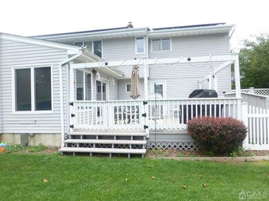 Rear Deck to sliders to Family Room.