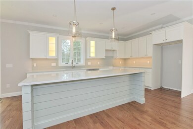 Kitchen Island has seating for 5.