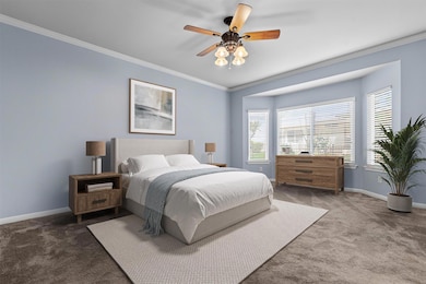 Carpeted bedroom featuring ornamental molding, mu