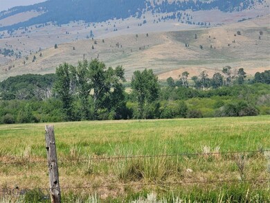 Property view of mountains featuring a rural view