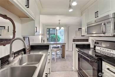 Your kitchen is a total winner — featuring newer appliances, fresh cabinetry, stylish new hardware, and a double sink for added convenience!