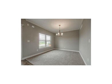 Living Room with crown molding. Double window for 