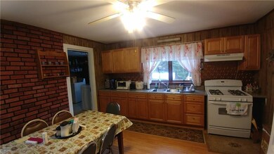 Kitchen with new cabinets and countertop.  Kitchen