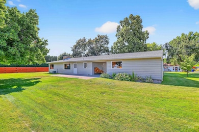 Back of house featuring a patio area and a chimney