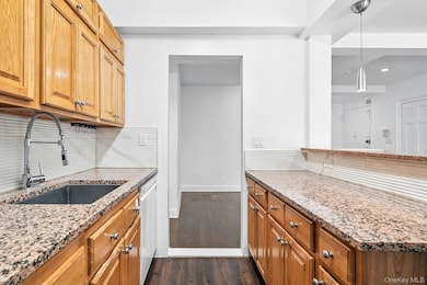 Kitchen featuring oak cabinetry.