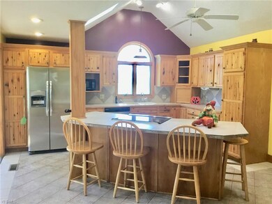 Kitchen with custom cabinets, new refrigerator and