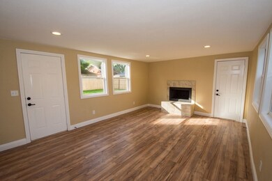 Main level Family Room with wood burning fireplace