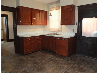 Spacious eat-in kitchen with newer flooring.