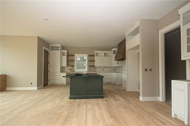 Three tone cabinets, large center island, quartz c
