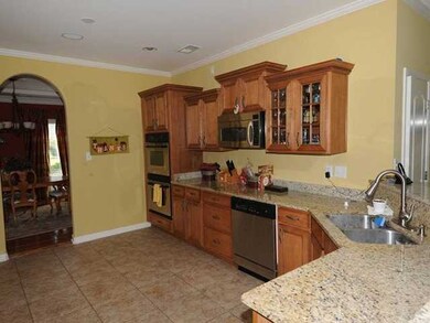 Glass front cabinets, pull down faucet, double ove