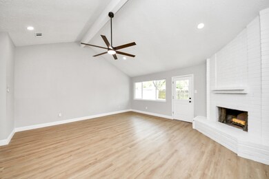 This spacious open-concept living area features a
