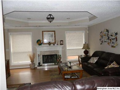 View of the living room with fireoplace and trey c