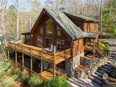 Not your average log home. Stone walls and paths a