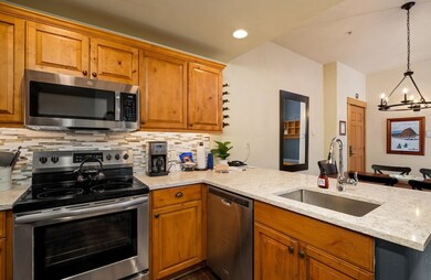 Kitchen featuring appliances with stainless steel