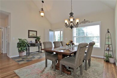 Beautiful Light Fixtures adorn the dining room open to the remodeled kitchen. Entertaining friends and family will be a breeze.