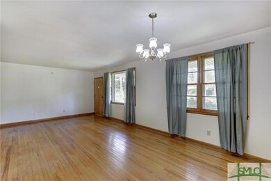 Large living room w/ lots of natural light. The ha